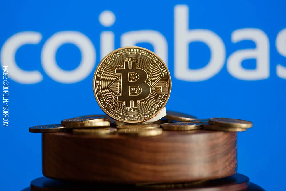 Bitcoin sitting on a pedestal with the coinbase logo behind it